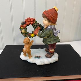 Boy/ dog figurine